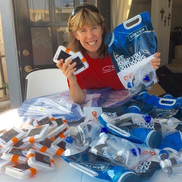 Pile of luminaid lights and water filters. 